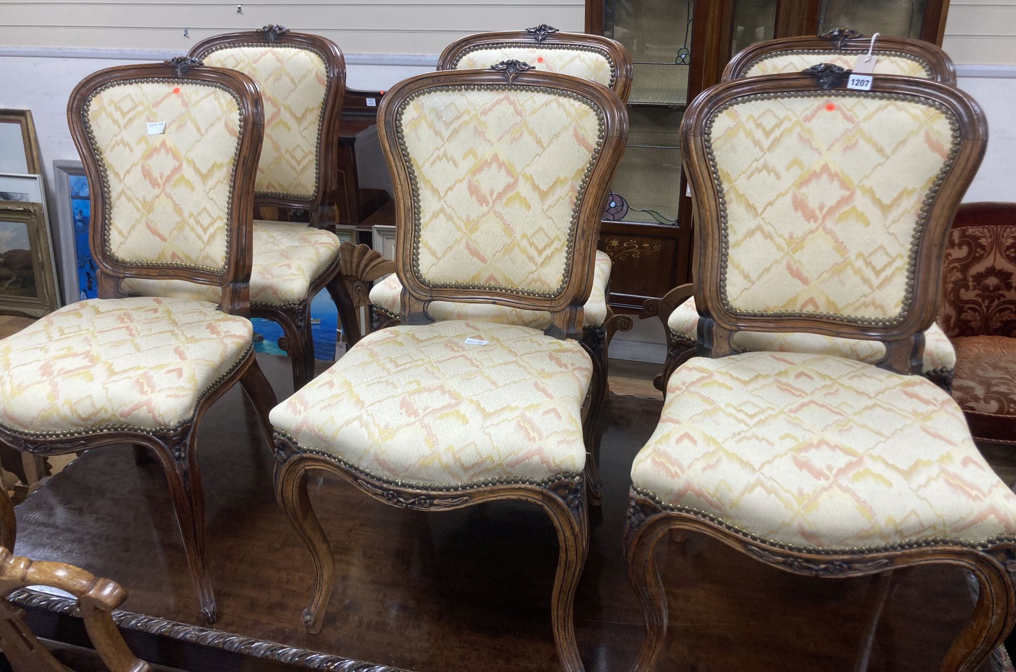 A set of six Louis XV style dining chairs, with cream and pink silk upholstery